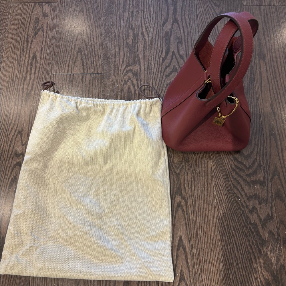 Trending Leather Burgundy Handbag with Dust Bag.